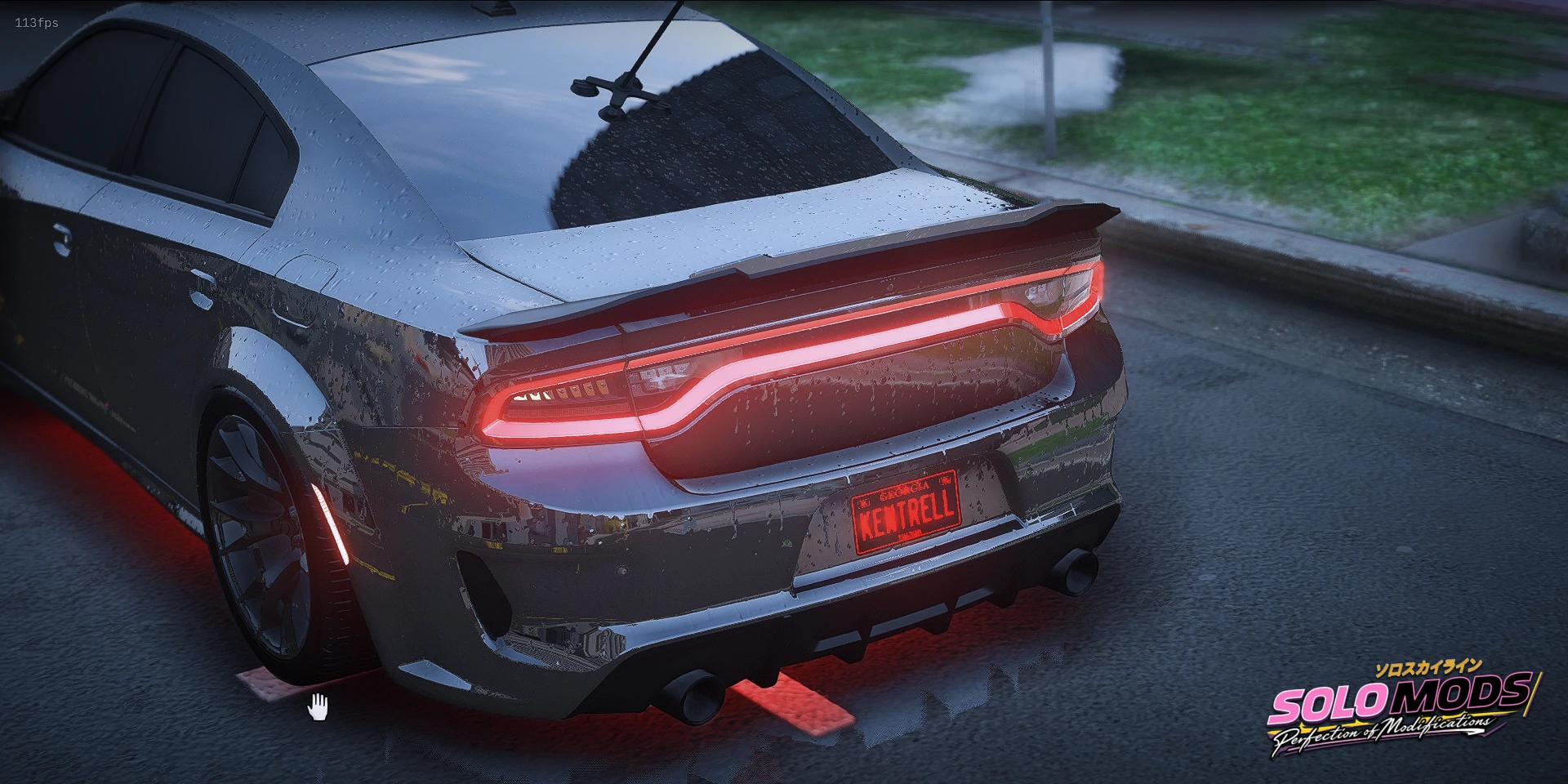 Gunmetal widebody Charger with a red light bar